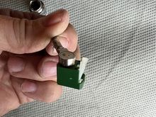 You will have to pull each white tab up in order for the data cable to release and allow its removal from the antenna