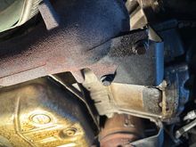 This is the bracket holding the CAT to the bolck. There are also 2 other bolts holding the bracket to the block that may have to come out. 