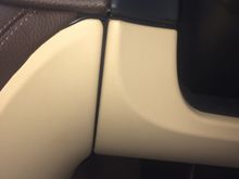 The cable goes under the steering column and again tucks in the joins of the dashboard, here the cables run down where the brown and cream panels meet, I also have a third cable hidden in the vertical groove here, this is a larger cable that runs an independent Tom Tom navigation device when I use it.