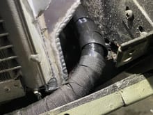 There is small flange with a hole that captures the AC condenser that had to be ground down on each side to reduce chance of rub through on oil lines. (This is driver, passenger side below has same issue). 