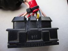 Two cuts with dremmell per connection, insulated the capacitors legs, then secured to cables with nylon tie.