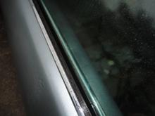 Left side chrome strip with the short side toward the glass. Note the rubber does not touch the glass.