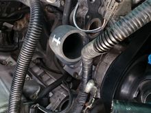 Short corner of the hose on the top side.