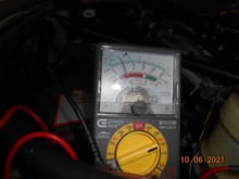 Not clear. but the reading drops to 8v at the - side of coil and dreaded wire plug coming from the amp when cranking the engine. Needle does not move during cranking mode
