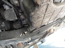 View of factory oil pan drain plug