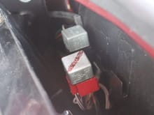 On the RHS in the Boot/Trunk on a (UK) Car are Two Relays. The Red One is the Main Relay and the Black One is the Fuel Pump Relay.