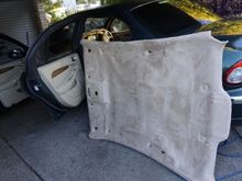 When I pulled the liner out of the car, I pulled it out by the rear left (passenger) door. All the seats were removed. But as you saw before, the headliner was in a pretty collapsed condition (esp. as I have a sunroof). In the restored condition it was now too big to get in there again. 