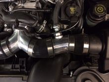 Since I can't weld aluminum, I used a port system. A one inch hole is drilled into the pipe and I used a very small amount of JB Weld (heavy duty spec - 550 degree temp) to seal the inner flange and outer nut assembly.