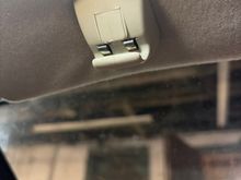 Ok got the console down but stumped here on the sun visor bracket. The screw has been removed on both but cannot get either to budge! 