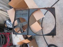 Fan shroud with elec fan. Some surface rust on bottom but not mangled or dented up