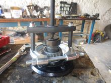 You need a bearing puller like this to remove the INNER race of the OUTER bearing from the hub tube.