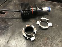Metal Adaptor fitted over plastic LED barrel socket for fitting into the high beam housing.