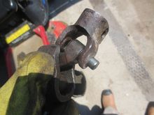 Here it is coming out, the un-dremeled part of each bearing cap is still in place in the bracket