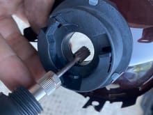 Use a Dremel with a carbide bur to increase the diameter of the reflector's bulb holder hole. DO NOT grind the reflector part of the bulb holder hole. 