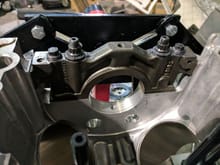 A cap bolted in place with M10 studs/nuts and M8 bolts