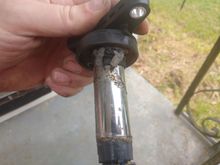 Cyl #1 ignition coil, newly installed and tested on a short test drive. Appears to be melting. I removed excessive dielectic grease from spark plug and replaced with older, working coil.