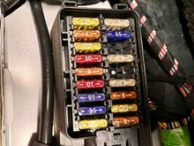 fuse box located rear passenger 