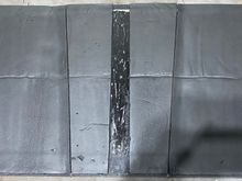 Fiberglass sound deadening backed hood liner.