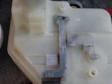 There are 3 outlets under the ABS Reservoir where Brake Fluid will come pouring out if you remove it