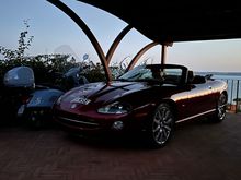 I had this shipped from California to Florida. I drove it to Charleston then it went by sea to Southampton and on to London. Car was stripped, repainted in its original Radiance Red and then new top fitted in identical fabric. Then drove it to Folkestone…..channel tunnel to Calais down to Bruges, Basel and to Bologna. Car is now in Europe. XK8 Victory 33,000 miles from new with complete service history.