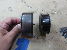 90mm original pulley vs. 76mm purportedly replacement pulley. The new belt does NOT fit between the edges