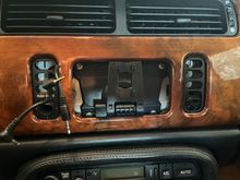 and that's how the wires exit through the fascia. Top hole has the Aux cable wire (dangling), middle has the reverse - camera AV cable, and bottom has the power wire. 