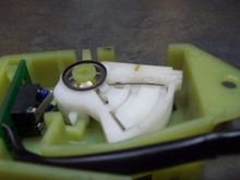 Spring wire (upper wire) held in with two tabs