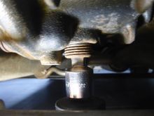 Remove drain plug with 3/8in square drive. Make sure you have a container handy to collect 85