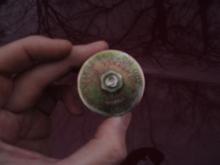 This is the top view of a device called an "Expand-Tite".  It's basically a bushing between two large washers with a bolt to tighten.  When tightened, the bushing is expanded to plug the newly drilled access hole.