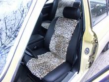 Jaguar front seat - I love how this feels sitting in it - cozy and soft.  The upholstery shop rebuilt up the foam, so instead of feeling like I'm sitting a little in a hole, it's firm and cushioned.  The black is a hide-textured high quality 
imitation leather.