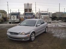 my jag in front of my gravel trucks