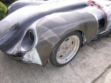 Once happy with the shape (after LOTS of sanding and bodywork), we then trimmed a nice single piece of carbon fiber cloth to fit the new fender.