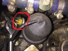 Is the circled sensor the oil pressure sending unit??  What is the big unit to the right of it??