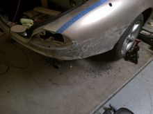 Getting there! The next step is to remove all of the paint down to bare metal, and use heat to shrink the metal back to it's original contour.