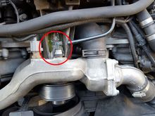 The [now] broken hose at the front of the engine.