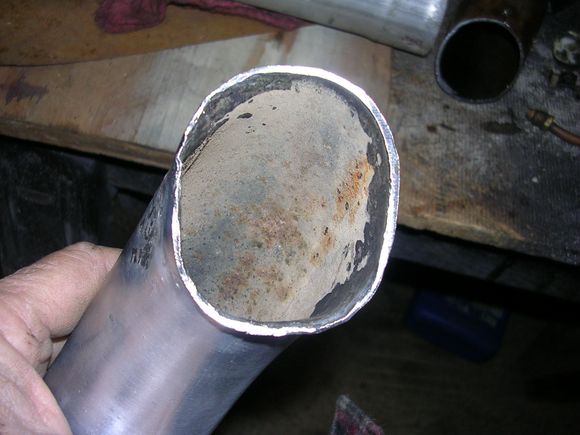 Ovaled to match the flange