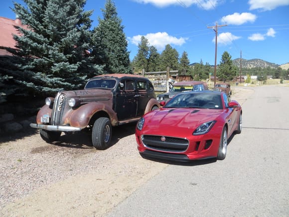 Here is theold adn the new in Guffey, CO.  I think this is a 1937 Plymouth, notre the suicide doors.
