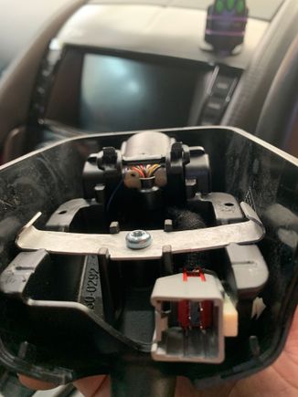 View of detached mirror and brace that you just slide onto to mirror base still attached to the windscreen 