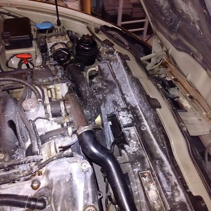 This is with the engine covers off. Everything is visible. You'll need a small mirror to see the bottom bolts for the tube though.