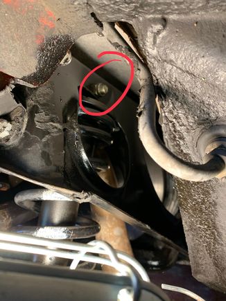 Nut outside the cage at rear