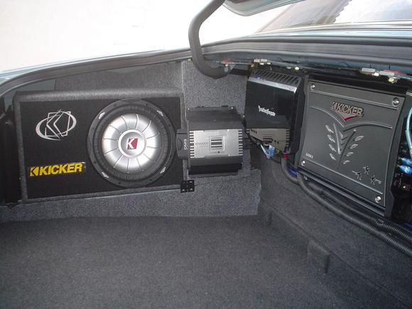 The subwoofer does not protrude because it's a slim unit and neither do the amps because they hang from the rear shelf - Tweeter amp is hidden behind the subwoofer