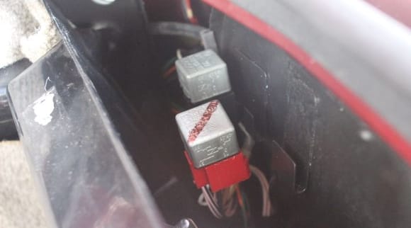 On the RHS in the Boot/Trunk on a (UK) Car are Two Relays. The Red One is the Main Relay and the Black One is the Fuel Pump Relay.