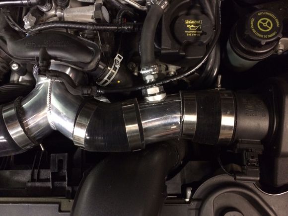 Since I can't weld aluminum, I used a port system. A one inch hole is drilled into the pipe and I used a very small amount of JB Weld (heavy duty spec - 550 degree temp) to seal the inner flange and outer nut assembly.