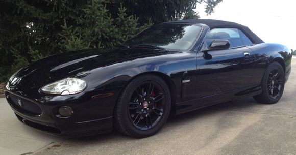 After sorting the issues (still many to deal with) had body kit put on and some paint repair but not satisfactory.  Decided to repaint whole car. Even painted wheels black for a total black look.