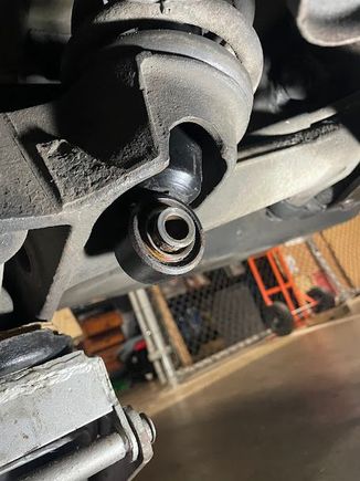 Bottom of shock protruding through the suspension arm.
