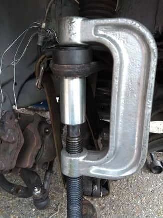 Using the jaguar tool 204-200 (basically a 38mm diameter pipe x2mm thk x 70mm long) to push out the upper ball joint. In truth, a slightly smaller tube would be better I think.
