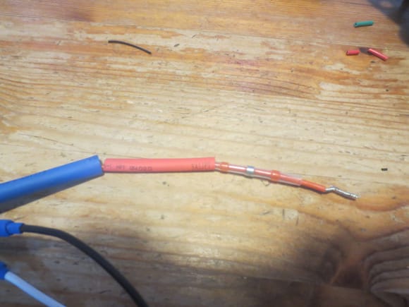 Close up of the silicone wires loaded with the solder shrink tube and the two heat shrink outers. 