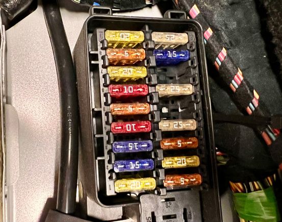 fuse box located rear passenger 