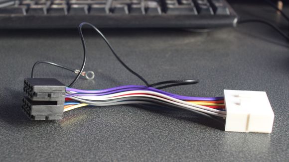 Will the Plug on the back of the Cage plug into the 'White' Adapter?