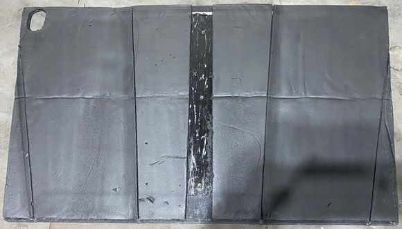 Fiberglass sound deadening backed hood liner.